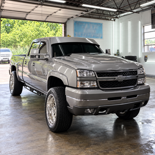 Silver Chevrolet Silverado with a finished TRUBLU Fab straight drop visor, front three-quarter view