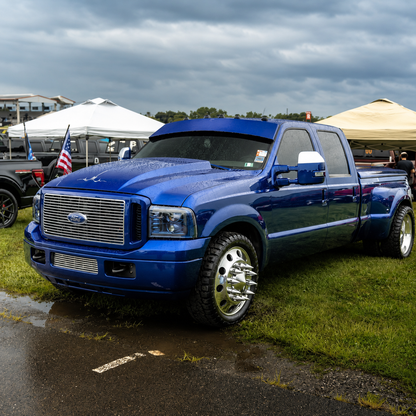 Award-winning dark blue Ford Super Duty dually with TRUBLU Fab straight drop visor at Carlisle