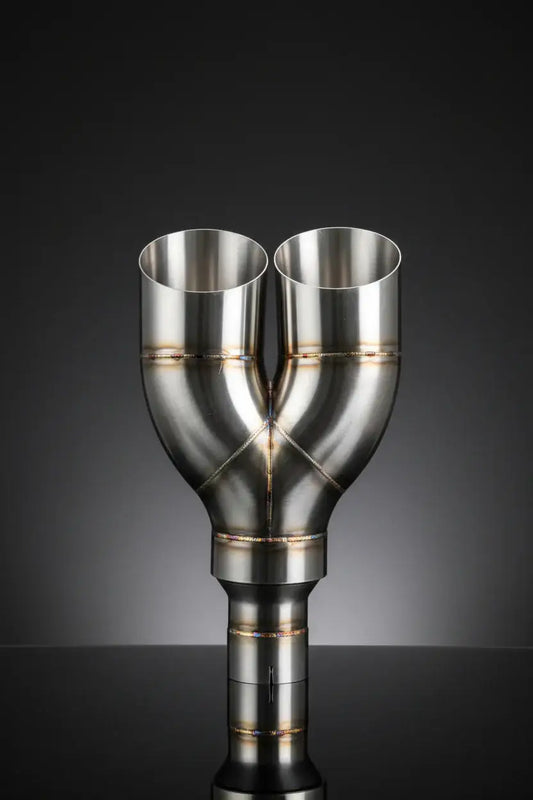 Stainless steel dual exhaust pipe with precision welds and reflective finish