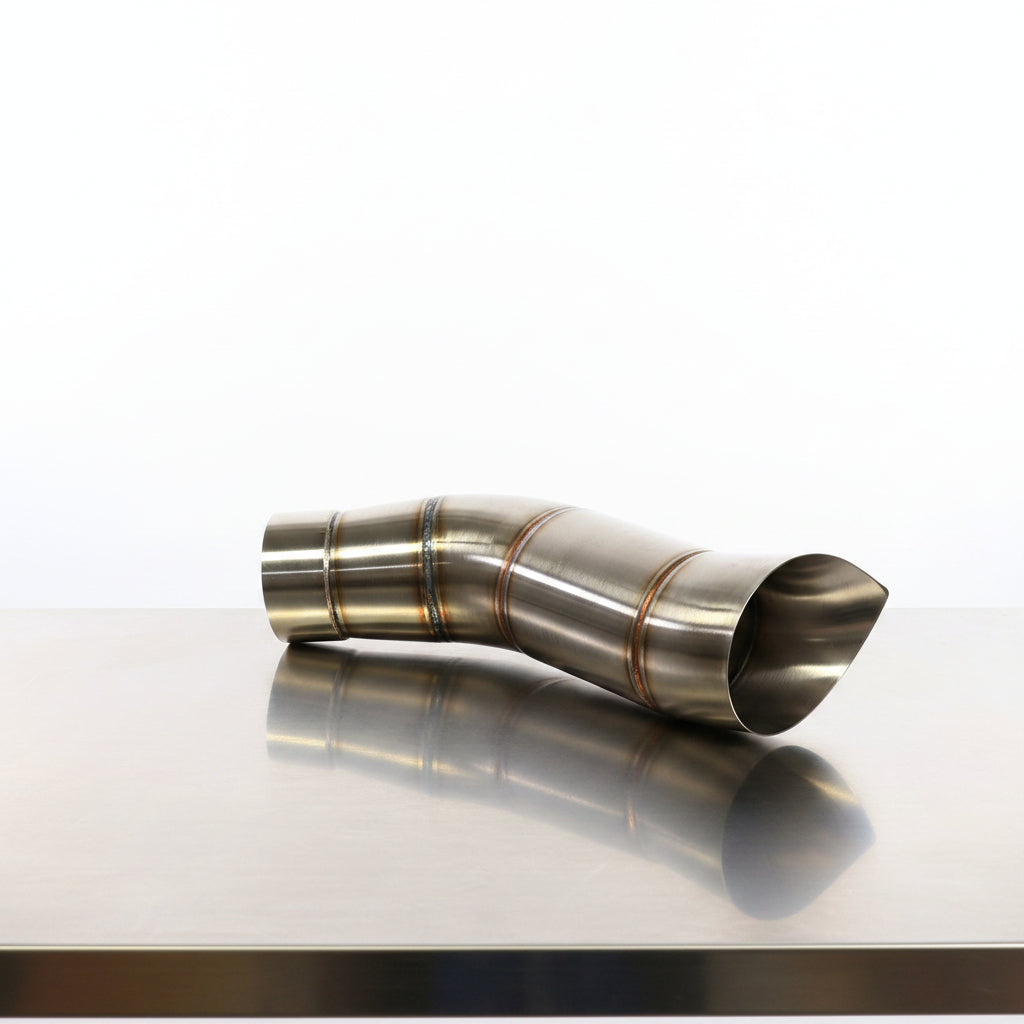 Metal exhaust pipe against a blue Trublu fab branded backdrop