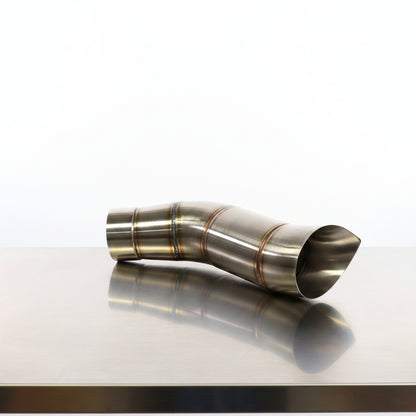 Metal exhaust pipe against a blue Trublu fab branded backdrop