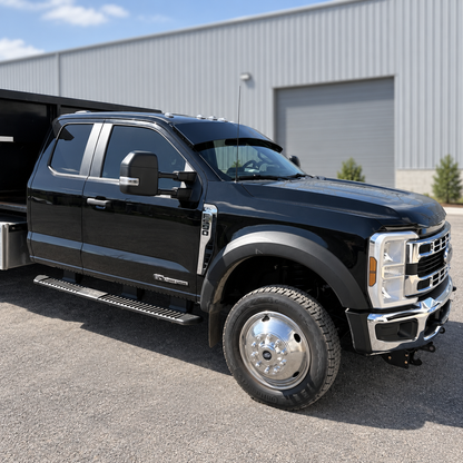 Side profile of a black Alumiduty drop visor installed on a Ford F-550
