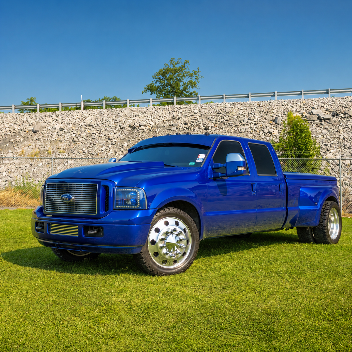 Dark blue Ford Super Duty dually showing the profile of a TRUBLU Fab straight drop visor