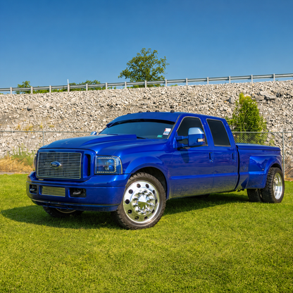 Dark blue Ford Super Duty dually showing the profile of a TRUBLU Fab straight drop visor