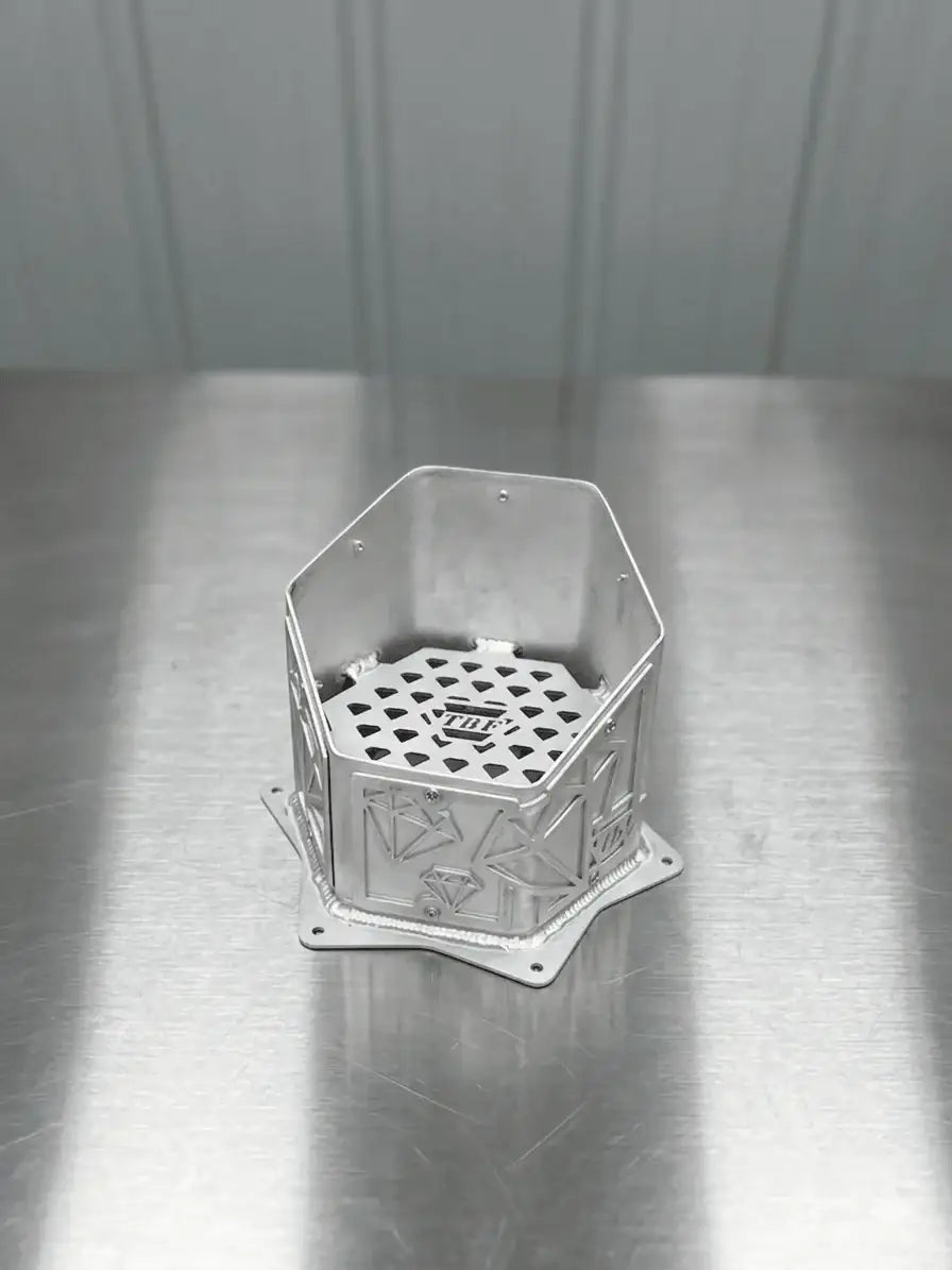 Diamond-Edition CNC aluminum hood-stack tip showing the geometric panels and TBF mesh