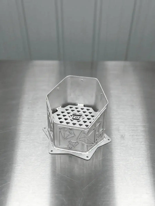 Diamond-Edition CNC aluminum hood-stack tip showing the geometric panels and TBF mesh